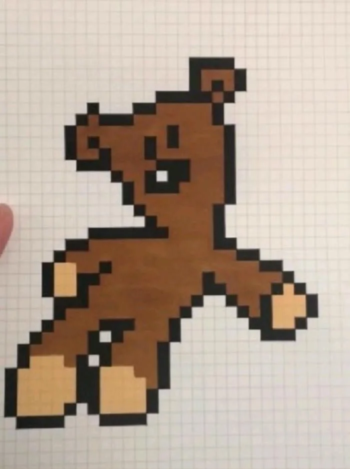 Tranh pixel đơn giản hình chú gấu nâu trên giấy ô ly